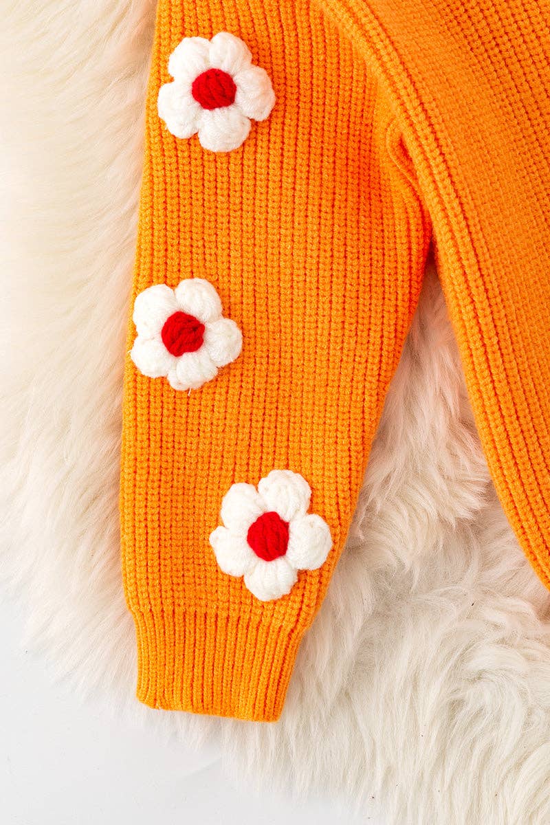 Orange Thankful knit sweater with embroidered flowers on sleeves. TPG60420 JEAN